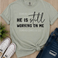 He Is Still Working On Me | Comfort Colors® Tee