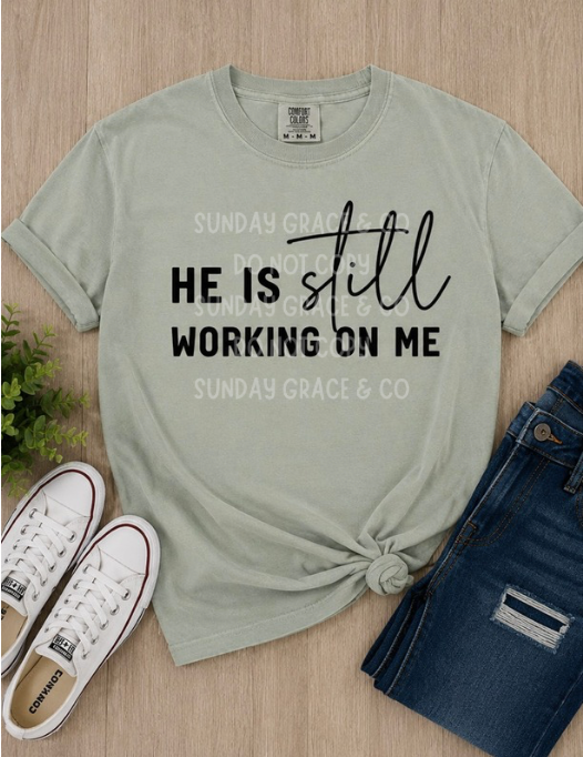 He Is Still Working On Me | Comfort Colors® Tee