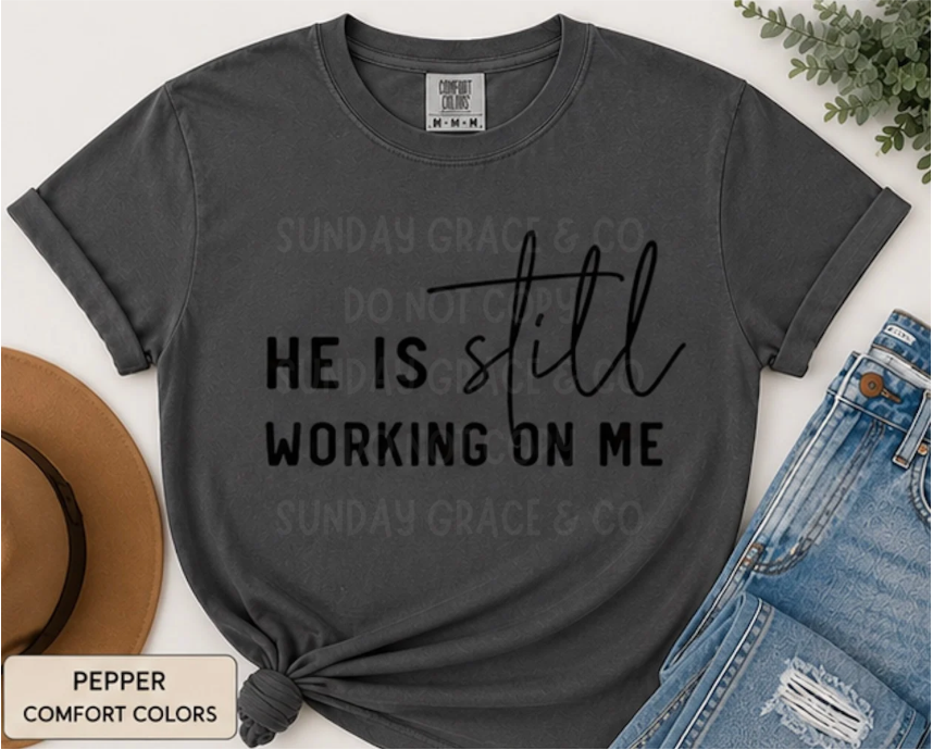 He Is Still Working On Me | Comfort Colors® Tee